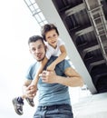 Mature father with his son under the bridge having fun together happy family, lifestyle people concept Royalty Free Stock Photo