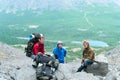 Mature father, mother and son hiking in mountains together