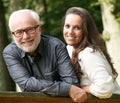 Mature father and young daughter smiling outdoors