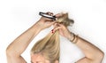 Mature female is combing her hair Royalty Free Stock Photo