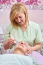Mature female in cosmetology clinic. Royalty Free Stock Photo