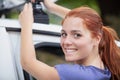 mature female cyclist taking mountain bike on car Royalty Free Stock Photo