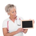 Mature female doctor with board Royalty Free Stock Photo