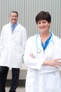 Mature female doctor with colleague Royalty Free Stock Photo