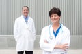 Mature female doctor with colleague Royalty Free Stock Photo