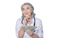 Mature female doctor with money Royalty Free Stock Photo