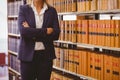 Mature female librarian posing with crossed arms