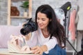 mature female photographer arranging shoes for presentation shoot Royalty Free Stock Photo