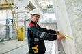 Foreman using tape measure to measure the stone