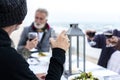 Mature friends drinking wine at the beach Royalty Free Stock Photo