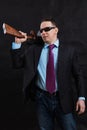 Mature gangster in sunglasses dressed in suit with tommy gun Royalty Free Stock Photo