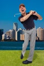 Mature golfer swinging his golf club Royalty Free Stock Photo