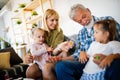 Senior grandparents playing with grandchildren and having fun with family Royalty Free Stock Photo