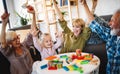 Senior grandparents playing with grandchildren and having fun with family Royalty Free Stock Photo