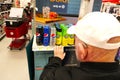 Elderly man\'s hand rests on Target store shelf where Sodastream flavored syrups are on display