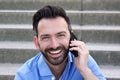 Mature guy talking on mobile phone and smiling Royalty Free Stock Photo