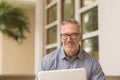 Mature handome fit man sitting outside stock photo