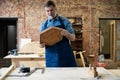 Mature handsome joiner work in carpentry. He is successful entrepreneur at his workplace. Royalty Free Stock Photo