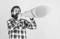 mature handsome man in checkered shirt speak in paper loudspeaker, advertisement