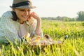 Mature happy woman farmer looking at newborn chickens in basket Royalty Free Stock Photo