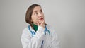 Mature hispanic woman with grey hair doctor standing with doubt expression thinking over isolated white background Royalty Free Stock Photo