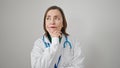 Mature hispanic woman with grey hair doctor standing with doubt expression thinking over isolated white background Royalty Free Stock Photo