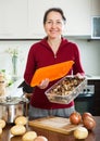 Mature housewife with dried mushrooms Royalty Free Stock Photo
