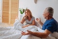Mature husband and wife having little quarrel in the bedroom Royalty Free Stock Photo