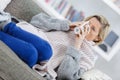 Mature illness woman drinking hot tea at home Royalty Free Stock Photo