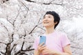 Middleage woman shooting with a smartphone