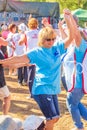 Mature Komsomol members dance on the military-patriotic site of the Grushinskaya Polyana