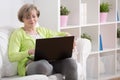 Mature lady with laptop