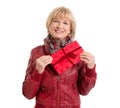 Mature lady is pleased with a gift - isolated on white Royalty Free Stock Photo