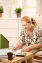 Mature lady working at home Royalty Free Stock Photo