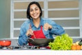 Mature latin american woman preparing vegetarian food