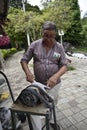 Mature Latin man sharpening a knife