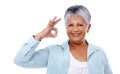 Mature lifestyle. Studio shot of a mature woman giving the ok sign isolated on white.