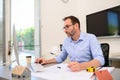 Mature male architect working on laptop on building project drawing sketch in office studio workspace Royalty Free Stock Photo