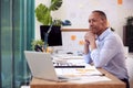 Mature Male Architect Working In Office At Desk Working On Plans For New Building Royalty Free Stock Photo