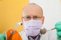 Dentist holding instruments, looking down Royalty Free Stock Photo