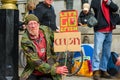 Mature male Extinction Rebellion Protester holding home made signs at a protest march Royalty Free Stock Photo