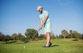 mature male golf player on professional course with green grass, golf course Royalty Free Stock Photo