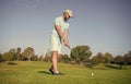 mature male golf player on professional course with green grass, golf course Royalty Free Stock Photo