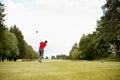 Mature Male Golfer Hitting Tee Shot Along Fairway With Driver Royalty Free Stock Photo