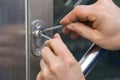 Male Lockpicker Fixing Door Handle At Home Royalty Free Stock Photo