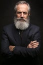 Mature male model wearing suit with grey hairstyle and beard Royalty Free Stock Photo