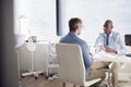 Mature Male Patient In Consultation With Doctor In Office Royalty Free Stock Photo