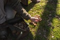 Mature male picker holding mushrooms at his hands after collecting it in the forest Royalty Free Stock Photo