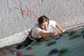 Mature Male rock Climber on vertical wall