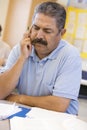 Mature male student frowning in class Royalty Free Stock Photo